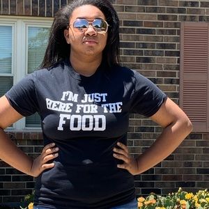 black shirt that says “i’m just here for the food”